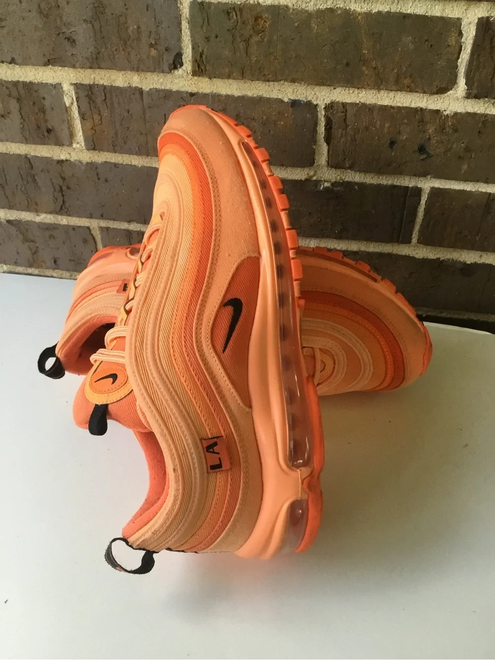 Nike Women’s Air Max 97 in Orange and Coral